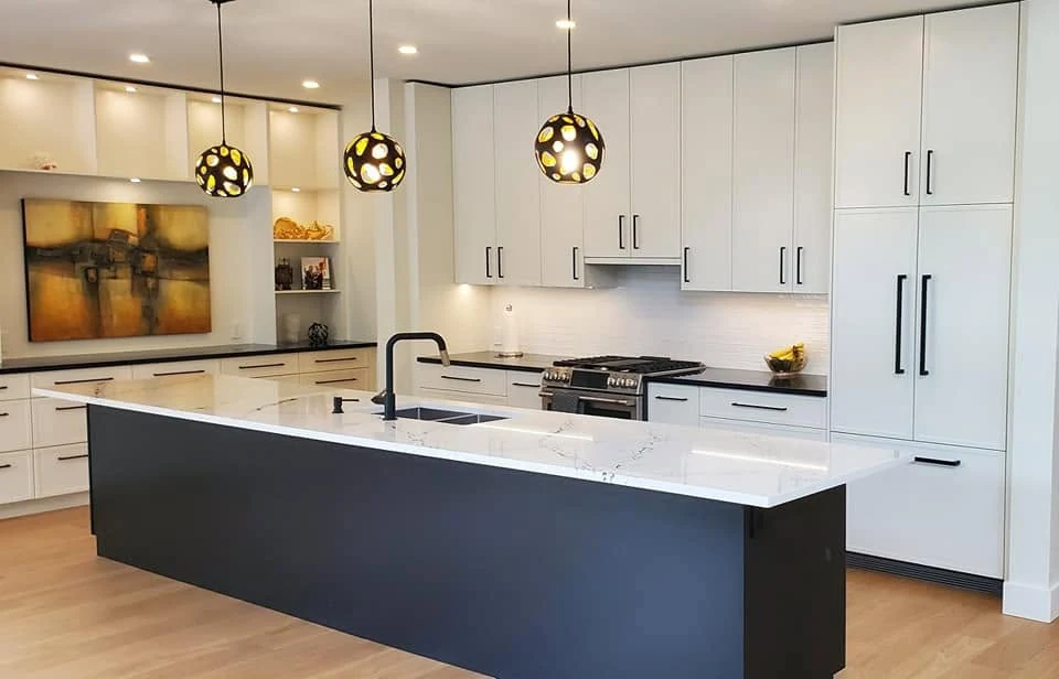 Modern kitchen with black island and white cabinetry