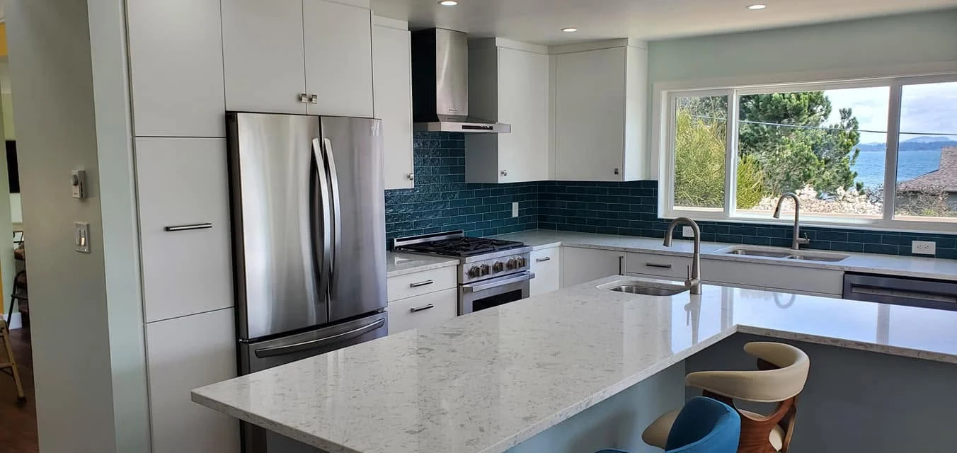 Custom kitchen with ocean view and blue tile backsplash