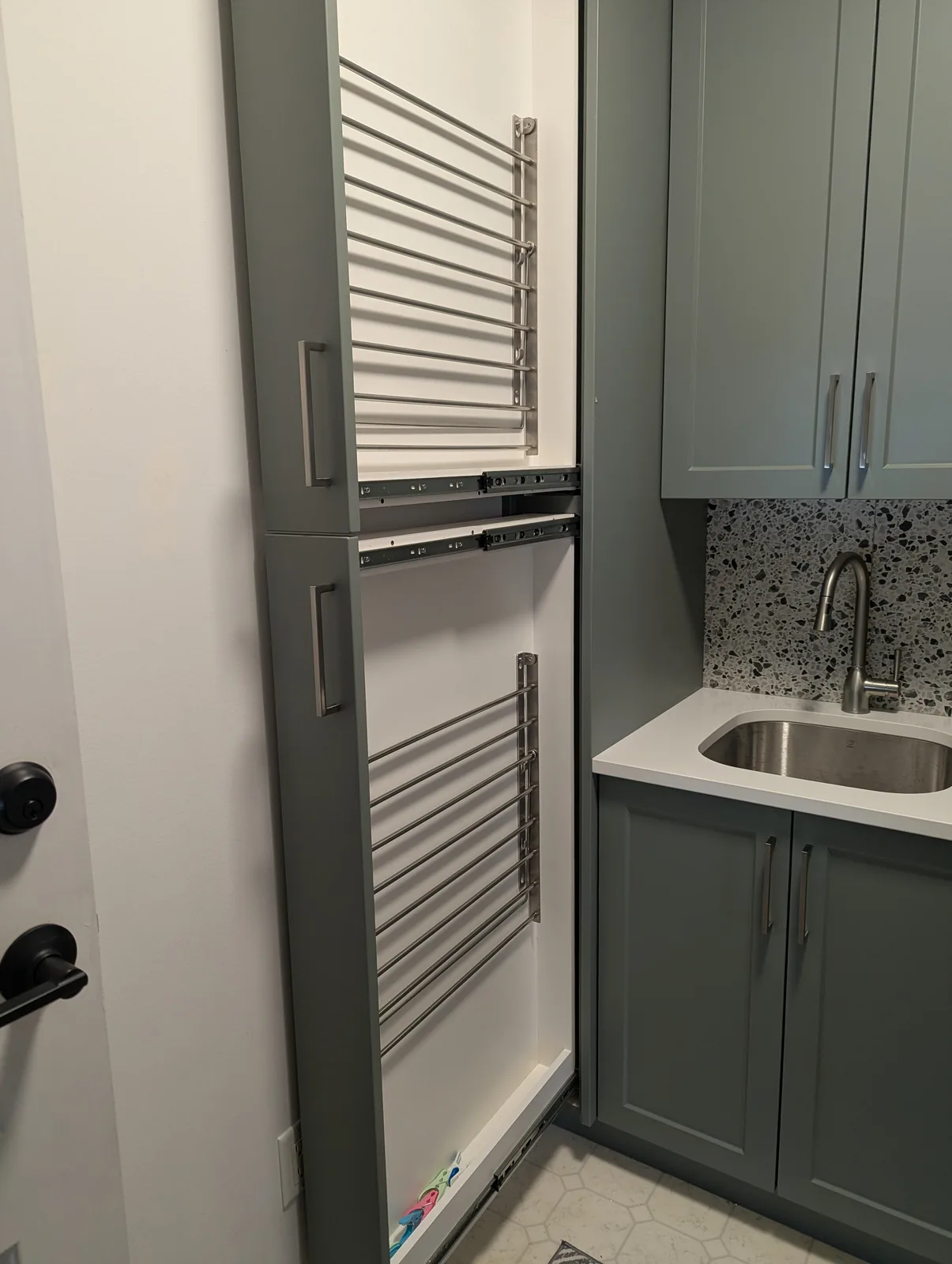 Laundry cabinetry with pullout drying racks